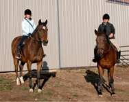 2 riders posing for photo